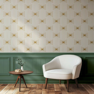 Art Deco gold and white geometric wallpaper with mid-century modern chair and table.