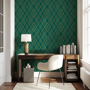 Art Deco emerald green and gold geometric wallpaper in a modern home office setting.
