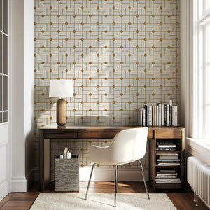 Art deco geometric retro gilded maze wallpaper in gold and white, enhancing a stylish home office with vintage sophistication.