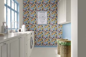 Laundry room with tropical leaves boho wallpaper, vibrant teal and coral abstract motifs, coastal and bohemian design.