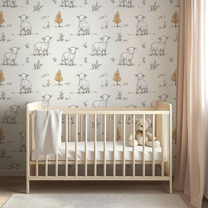Cozy nursery with Little Lamb Pastures wallpaper featuring hand-drawn lambs, perfect for a baby or children’s playroom.