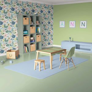 Modern room with Tidepool Treasures wallpaper featuring ocean-inspired starfish, seashells, and seaweed in calming coastal colors.