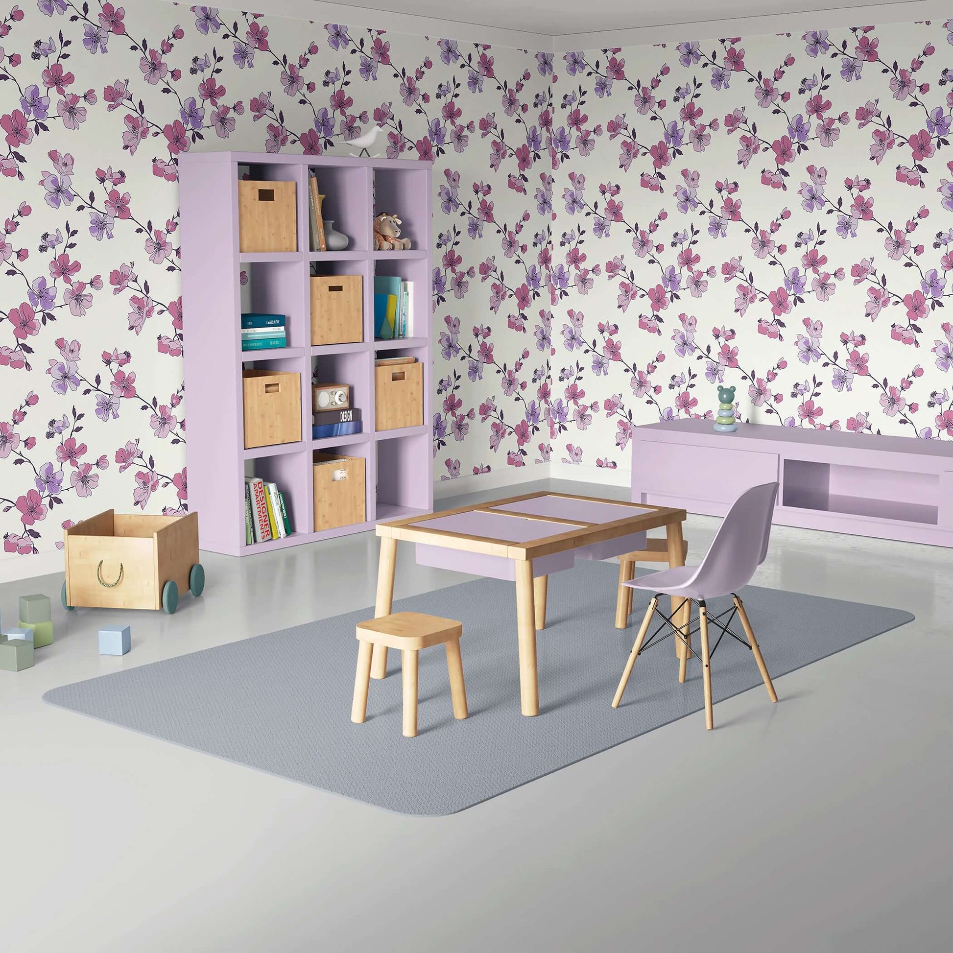 Botanical Blush wallpaper with pink and lilac blooms in a modern room setting, featuring wooden furniture and purple accents.