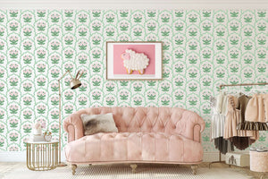 Preppy Pink Garden Lattice Wallpaper with florals and scallops adorning a nursery room with a pink sofa and charming decor.
