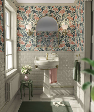Small bathroom featuring Flamingo Oasis wallpaper with mid-century modern design, highlighting flamingos amidst coastal greenery.