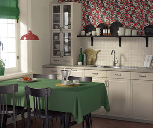 Contemporary kitchen with "Wild Poppy Passion" wallpaper featuring red poppies, black and white accents, adding flair to the space.