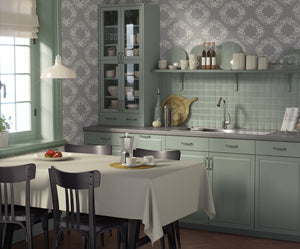 Elegant kitchen with Chic Wreath Design wallpaper featuring floral laurel wreaths, modern gray cabinets, and a cozy dining area.