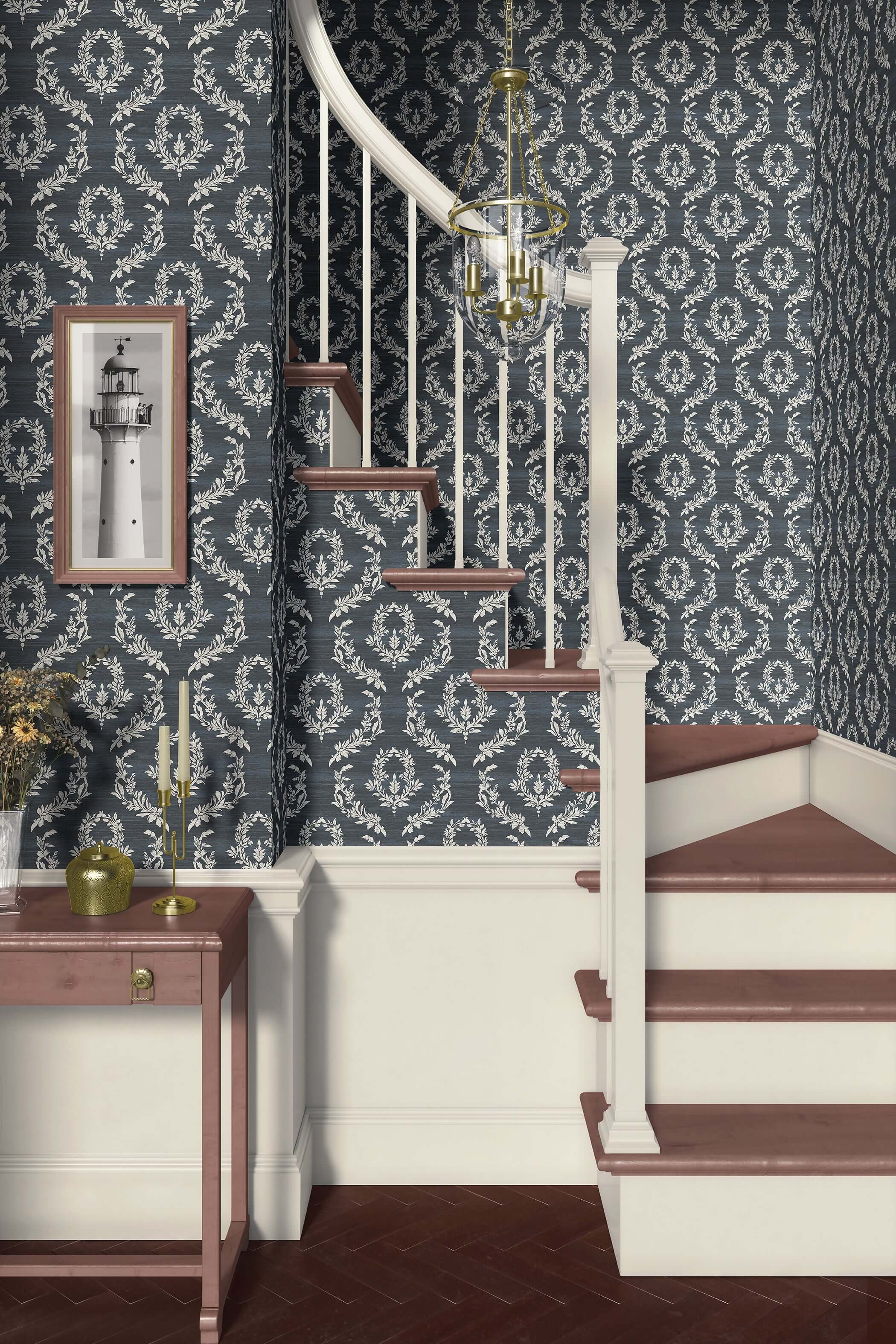 Elegant stairway with Midnight Laurel wallpaper featuring soft white laurel wreaths against a dark blue background; traditional florals.