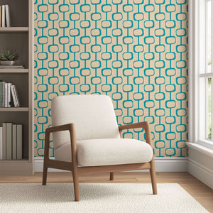 Palm Springs Modern wallpaper with geometric mid-century design in teal and beige, featuring a retro abstract pattern behind a chair.