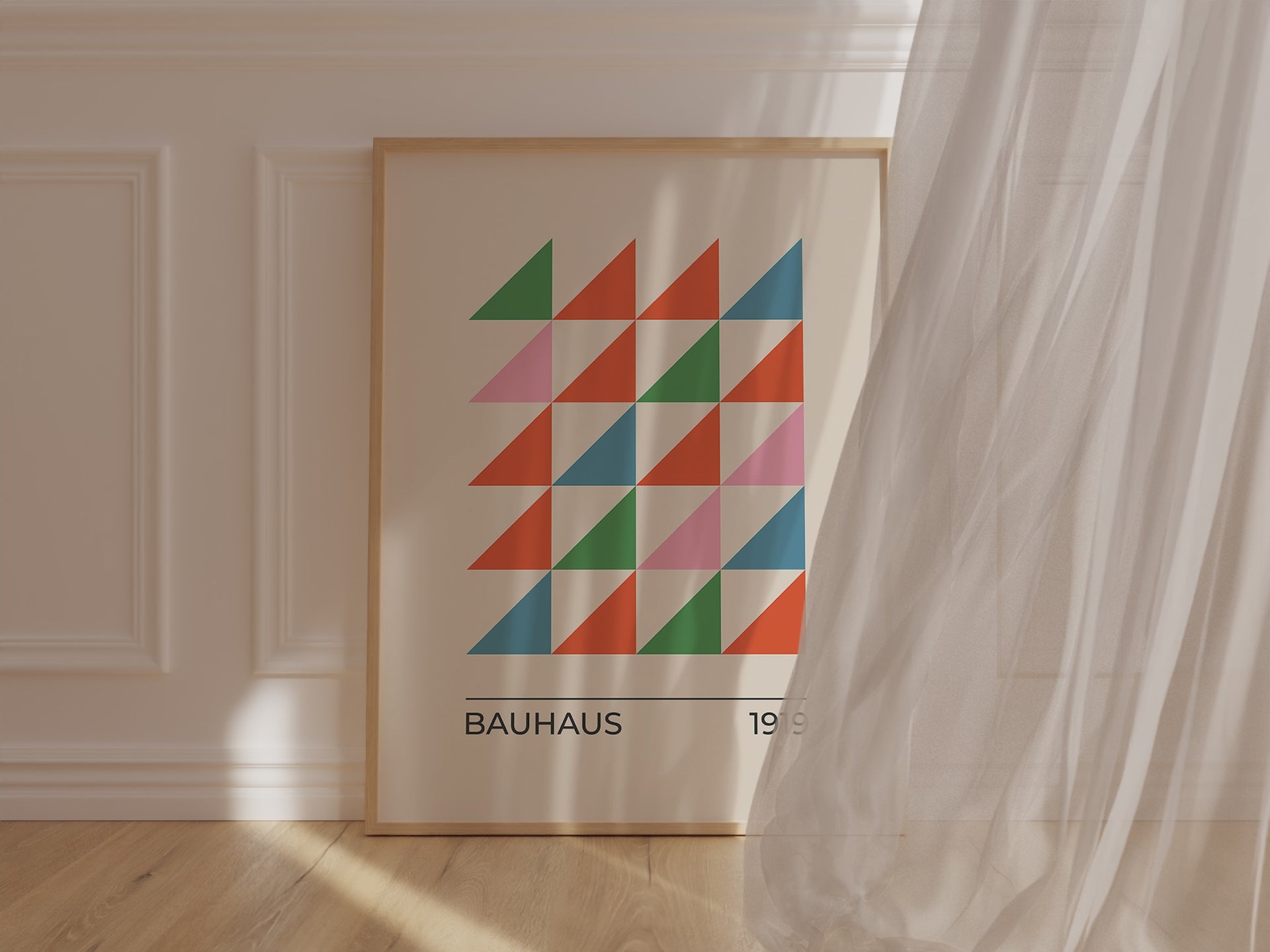 Bauhaus art print featuring colorful triangles in green, orange, and blue, celebrating modern art and design.