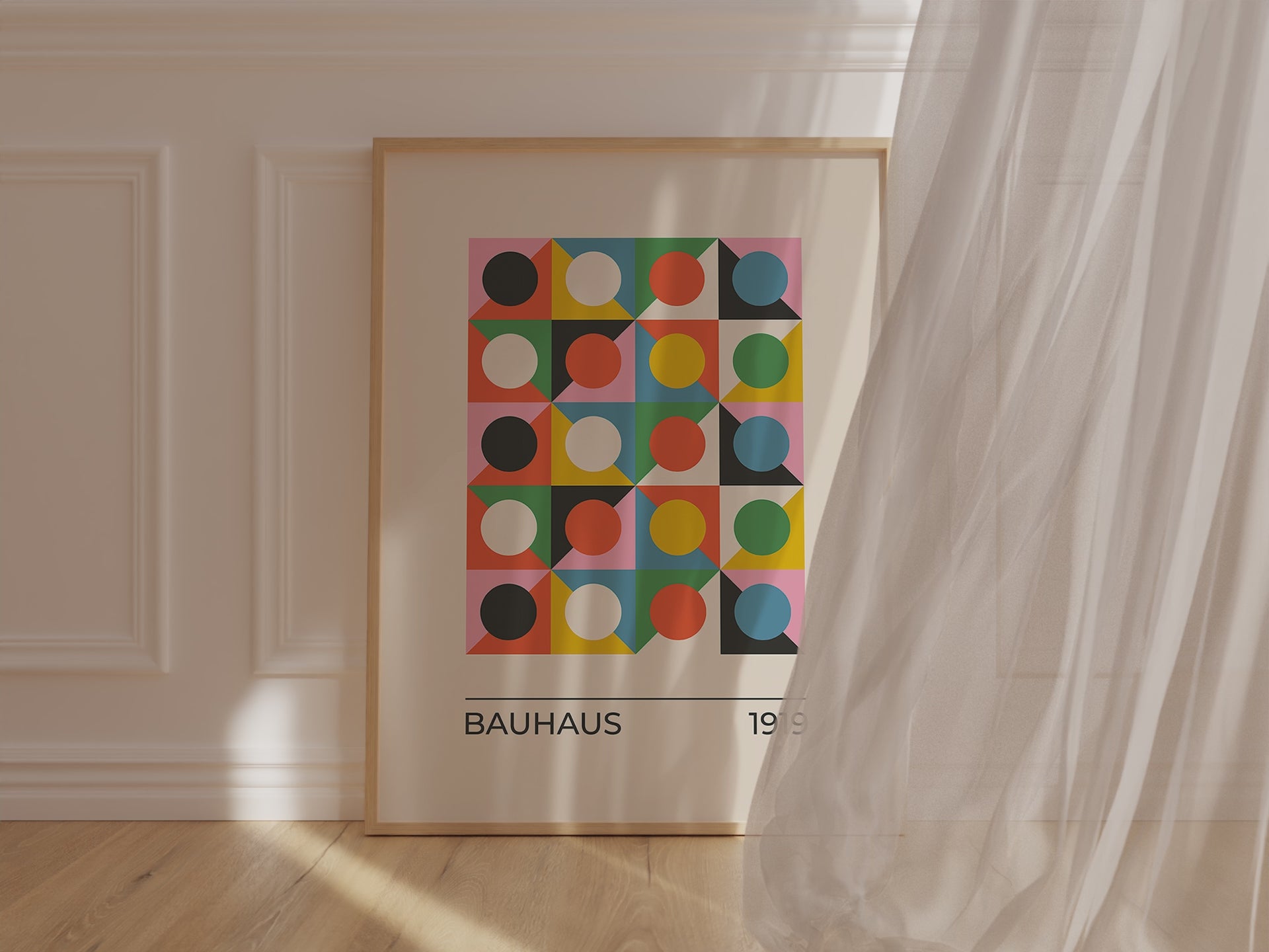 Bauhaus art print featuring colorful geometric circles and triangles in a modern interior setting.