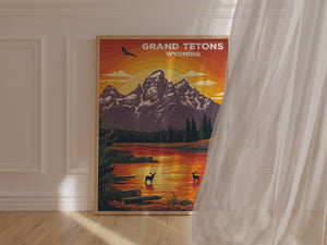 Golden sunset wall art of Grand Tetons, Wyoming with elk silhouettes and tranquil waters reflecting the vibrant sky.